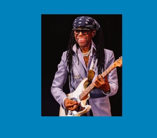 Nile Rodgers playing the guitar