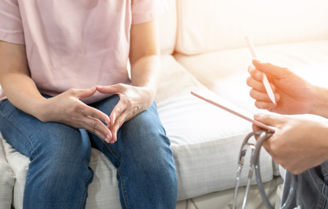 Woman receiving cervical screening consultation